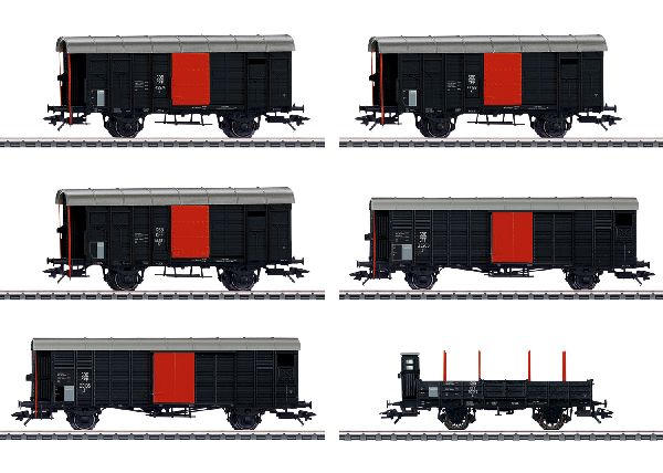 6 Güterwagen unterschiedlicher Bauarten der Schweizerischen Bundesbahnen (SBB) in fiktiver schwarzer Grundfarbgebung. 3 gedeckte Güterwagen mit Bremserhaus, K3. 2 gedeckte Güterwagen mit Bremserhaus, J3. 1 Niederbordwagen mit Bremserhaus L2