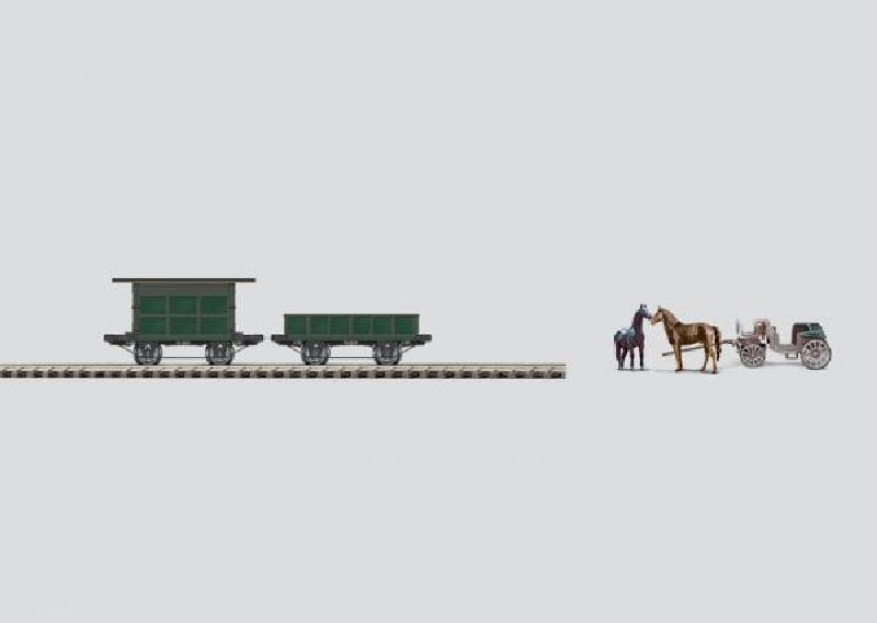 Württemberger Wagen-Set um 1859. Inhalt: 1 Equipagentransport-Wagen mit historischer Kutsche und Pferden (Preiser), 1 Pferdetransport-Wagen